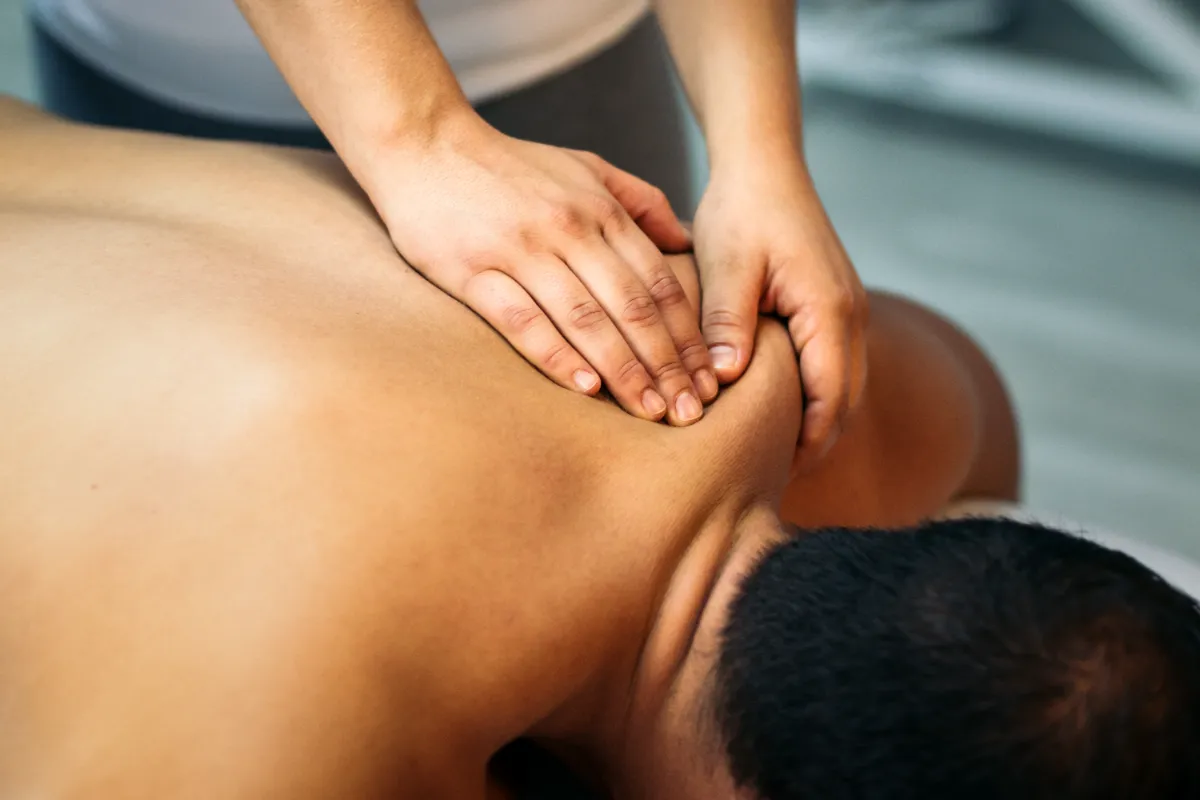 Therapeutic massage therapy helping to relieve muscle pain and tension.